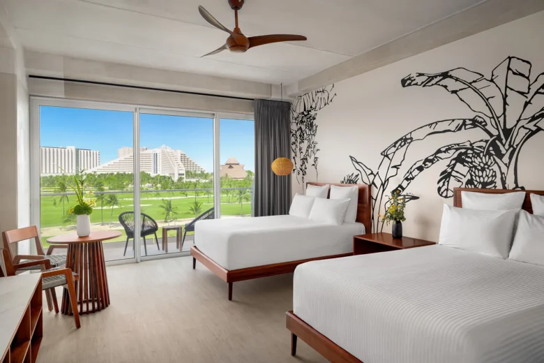 Junior Suite Golf View with two double beds and private balcony overlooking the golf course at Hyatt Vivid Grand Island.